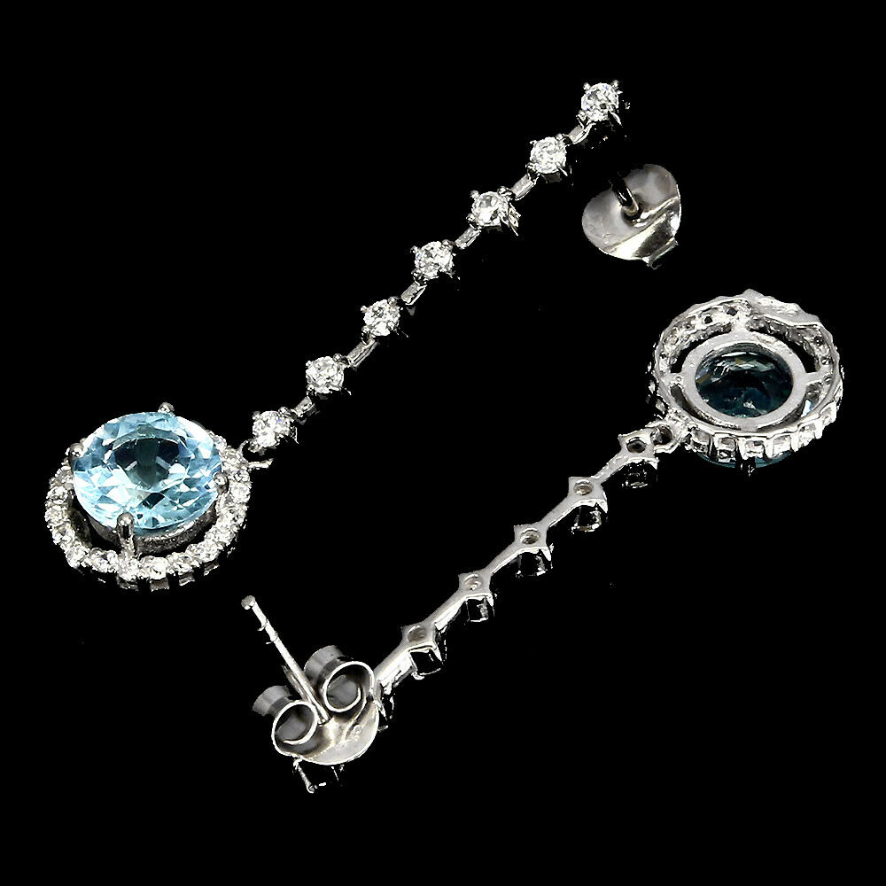 A pair of 925 silver drop earrings set with blue topaz and white stones, L. 4.2cm. - Image 2 of 2