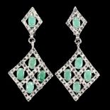 A pair of 925 silver drop earrings set with oval cut emeralds and white stones, L. 4cm.