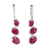 A pair of 925 silver drop earrings set with oval cut rubies and white stones, L. 4.5cm.