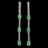 A pair of 925 silver drop earrings set with oval cut emeralds and white stones, L. 5.7cm.