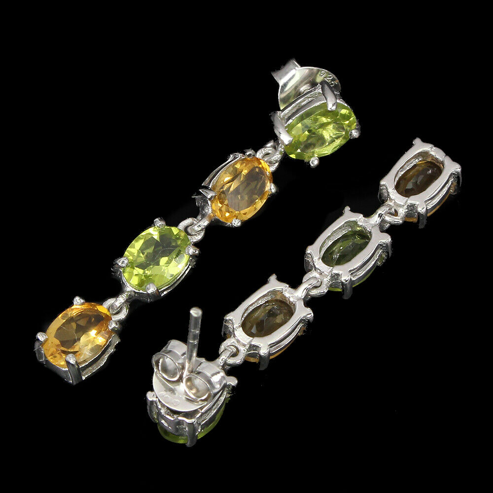 A pair of 925 silver drop earrings set with oval cut citrines and peridots, L. 3.8cm. - Image 2 of 2