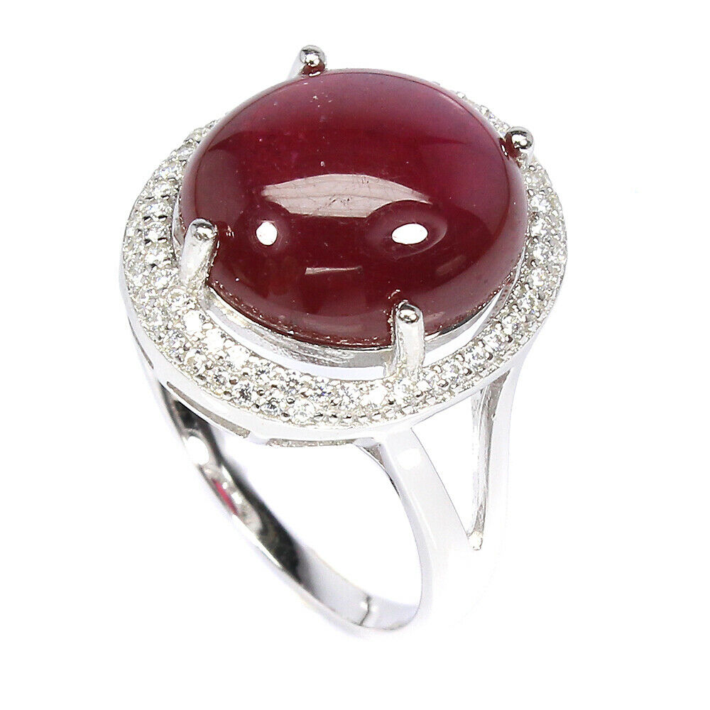 A 925 silver ring set with a large cabochon cut ruby surrounded by white stones, (P). - Image 2 of 2