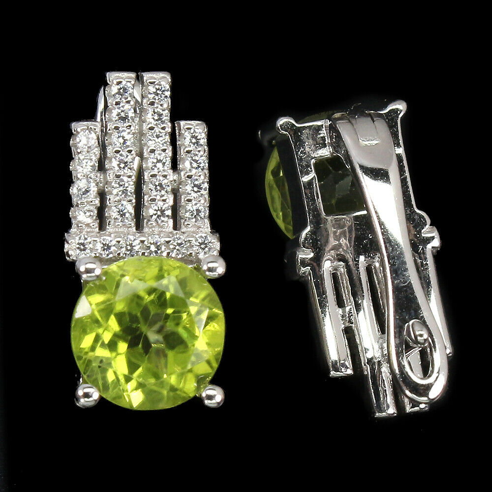 A pair of 925 silver earrings set with round cut peridot and white stones, L. 1.5cm. - Image 2 of 2