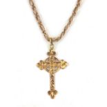A 9ct yellow gold (stamped 9ct) cross pendant on a 9ct yellow gold chain, L. 48cm.