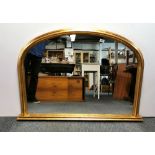 A large gilt framed over mantle mirror, W. 114cm, H. 81cm.