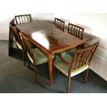 A 1970's Danish hardwood extending dining table and six chairs, table size 84 x 167cm extending to