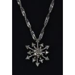 A Hot Diamonds 10ct (stamped 10K) white gold diamond set snowflake pendant, on a 9ct white gold