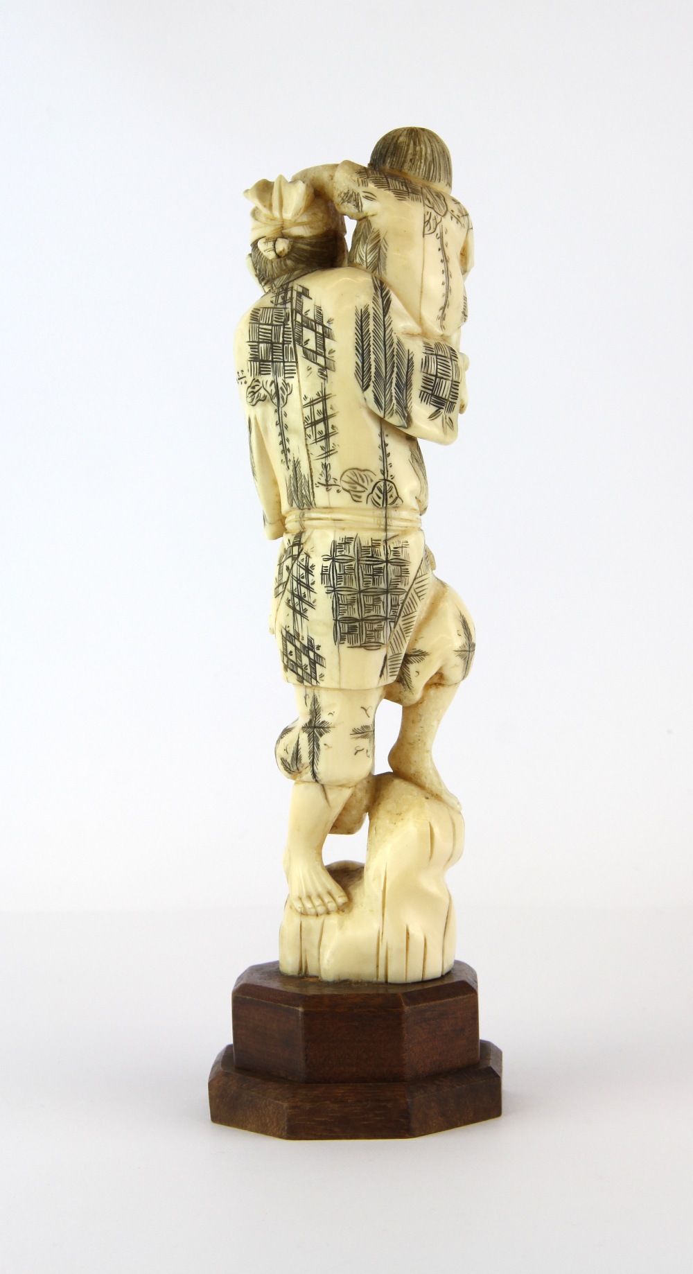 A 19th Century carved Japanese ivory figure on a later wooden stand, L. 25cm. - Image 2 of 2