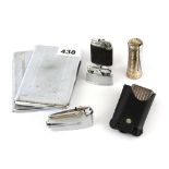 A group of vintage lighters and cigarette cases.