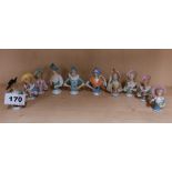 A group of ten small porcelain half dolls, tallest 6.5cm.