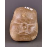 A large carved rock crystal baby's head, H. 16cm.