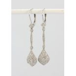 A pair of Art Deco style 18ct white gold (stamped 750) diamond set drop earrings, L. 4.5cm.