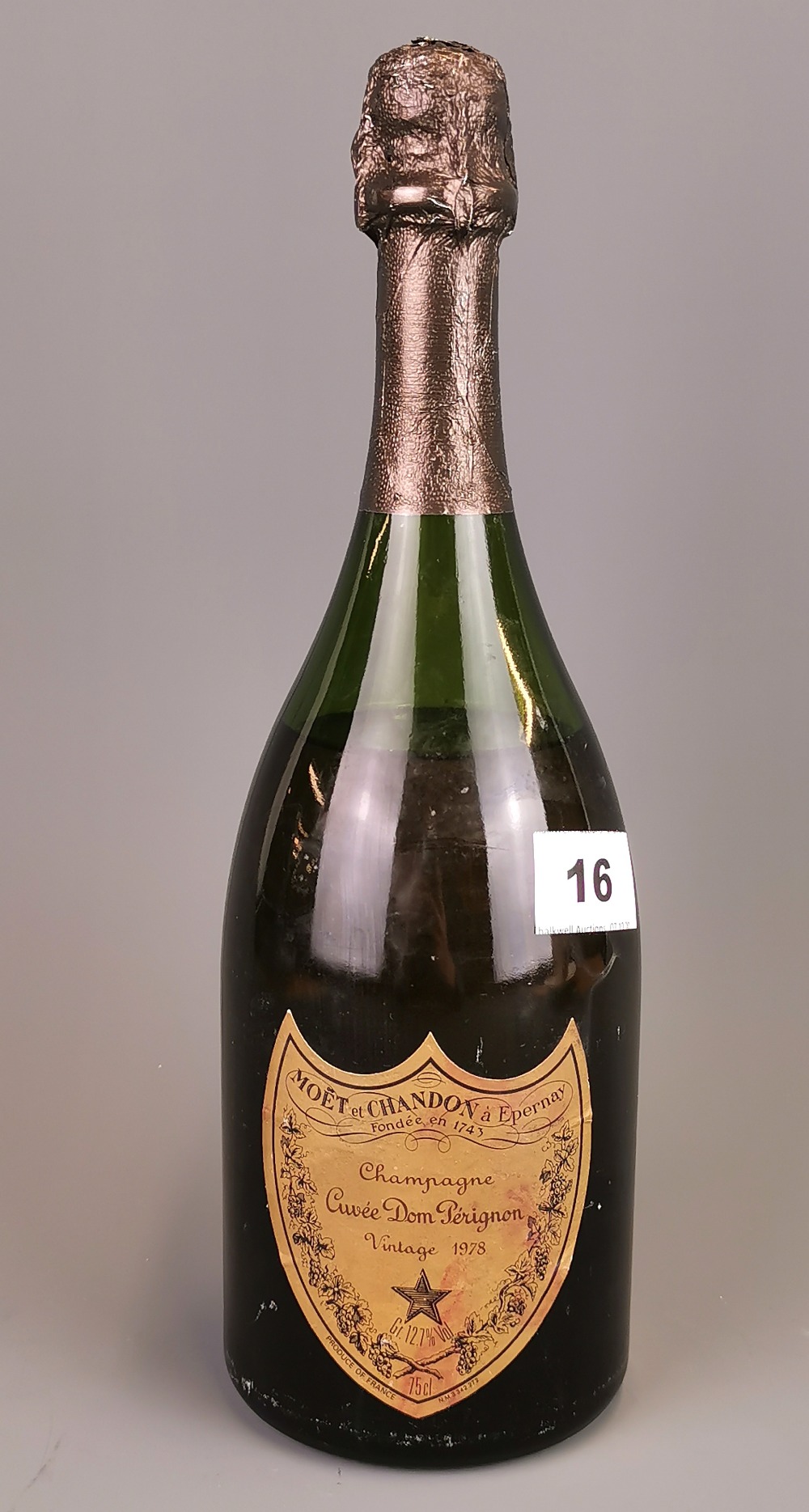 A bottle of Dom Perignon 1978 vintage champagne, sealed but part leached.