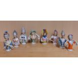 A group of eight porcelain half dolls, tallest 9.5cm.