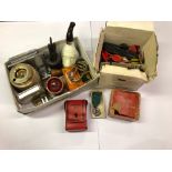 A box of mixed vintage items including darts and dart flights.