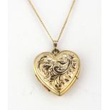 A 9ct yellow gold heart shaped locket pendant on a 9ct yellow gold chain.