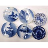 Four Dutch wall plates and further blue and white plates.