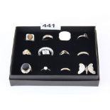 A box of twelve mixed sterling silver rings.