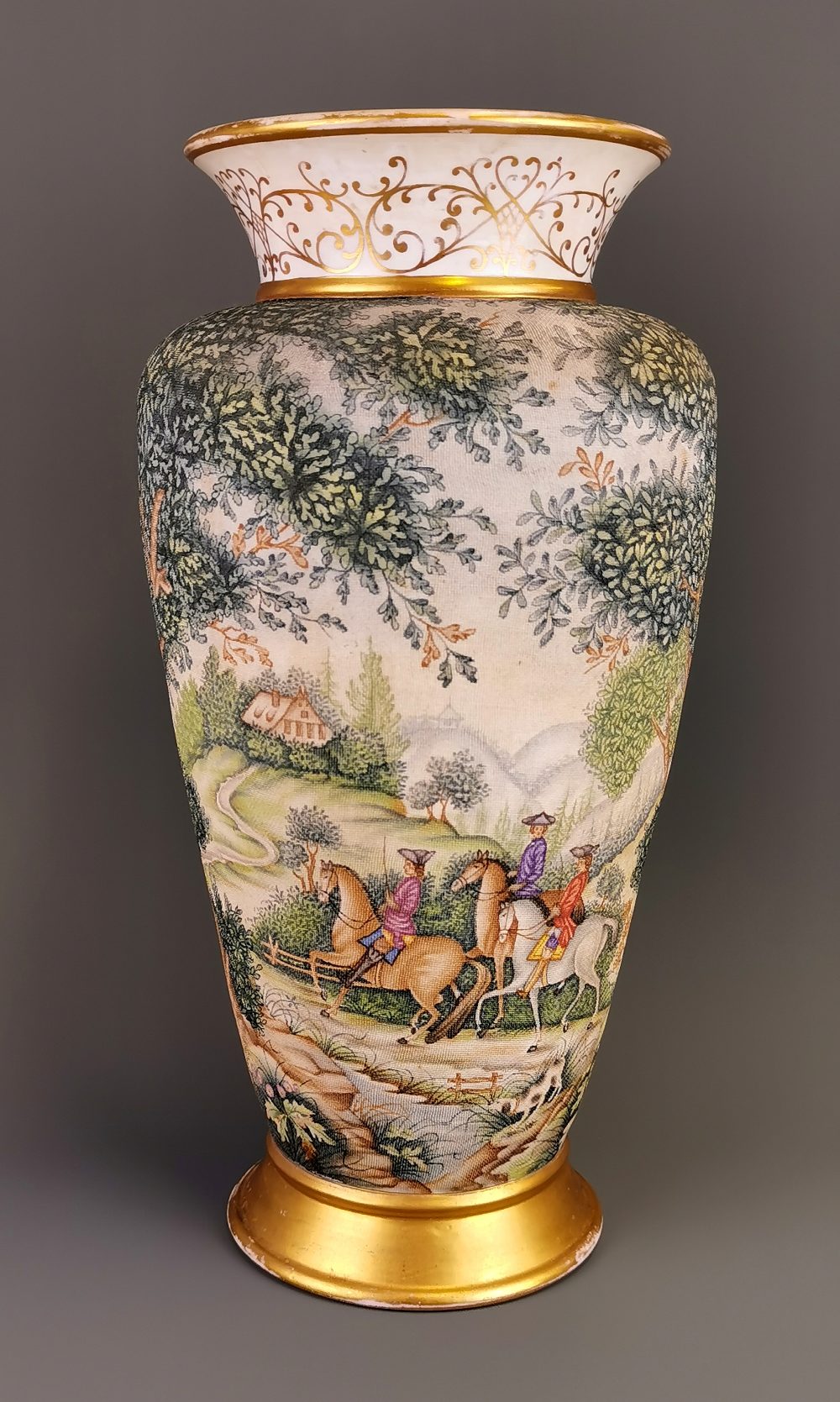 A large 19thC German hand painted and gilt porcelain vase. H. 44cms (small repair to rim)