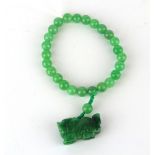 A polished jade bead bracelet.