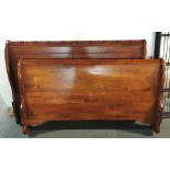 A carved hardwood double sleigh bed with ends, sides and metal mattress frame, W. 161cm.