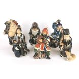 A group of six Chinese glazed terracotta figures of immortals, signed, H. 16cm.