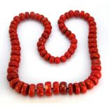 A large coral bead necklace, L. 104cm.