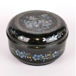 A Chinese mother of pearl inlaid lacquered papier Mache box, Dia. 11cm, D. 6.5cm.