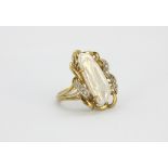 A 9ct yellow gold ring set with a baroque pearl and diamonds, (N.5).