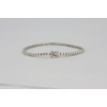 An 18ct white gold diamond set tennis bracelet, approx. 5.2ct of diamonds, L. 19cm.