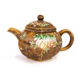 A Chinese enamelled terracotta teapot, H. 10.5cm spout to handle L. 17cm.