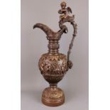 A large 19th Century bronze urn decorated with putti, H. 57cm.