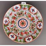 An 18th century Dutch Delft polychrome charger, Dia. 35cm.