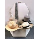 A gentleman's size 7 top hat with a Panama hat and two ladies hats.