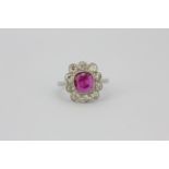 A 950 platinum cluster ring set with a 2.16ct cushion cut natural untreated Burmese ruby