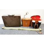 Two pairs of binoculars, a military webbing belt and a vintage briefcase.