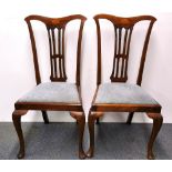 A pair of inlaid mahogany Chippendale style dining chairs.