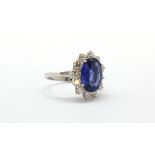 An 18ct white gold (stamped 750) ring set with a large oval cut natural Burmese sapphire
