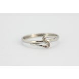 A 14ct white gold (stmaped 585) diamond set ring, (T).