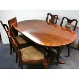 A mahogany extending pedestal dining table, extending from 153cm to 189cm, together with a set of