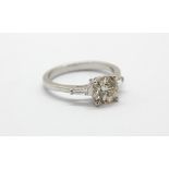 An 18ct white gold (stamped 750) solitaire ring set with a 1.5ct brilliant cut diamond and tapered