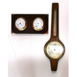 A wall mounted clock barometer and a further barometer.