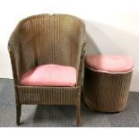 A gold finished Lloyd Loom armchair and laundry basket.