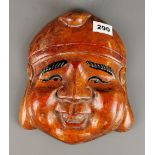 An early 20th Century Chinese carved and painted wooden mask, H. 25cm.