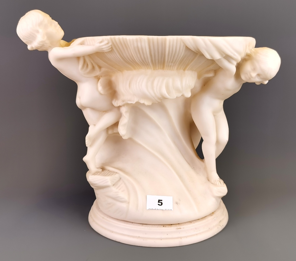 A large resin cherub bowl centrepiece, H. 33cm.