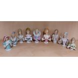 A group of nine porcelain half dolls, tallest 8cm.