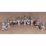 A group of eight porcelain half dolls, tallest 8.5cm.