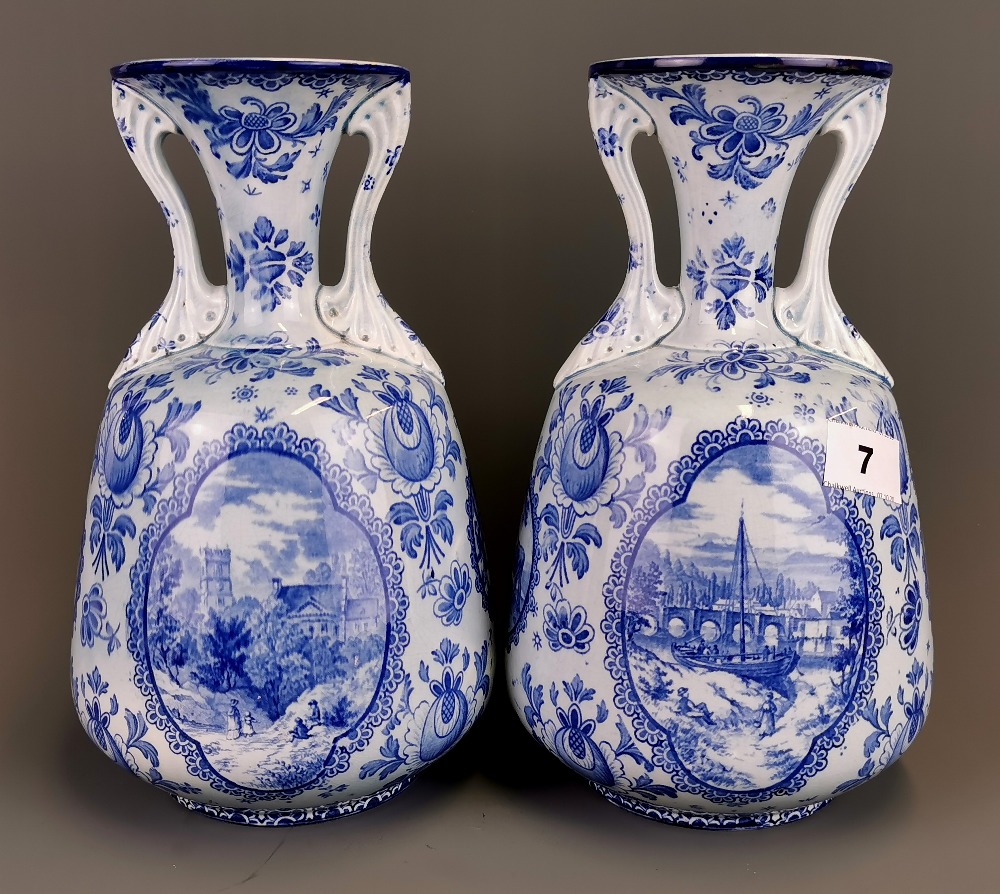 A pair of early 20th Century Continental Delft style porcelain vases, H. 26cm, no visible damage