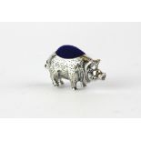 A small sterling silver pig pin cushion, 4.5 x 2.5cm.