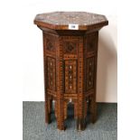 Islamic interest. A 19th Century Syrian inlaid table, W. 31cm H. 52cm.